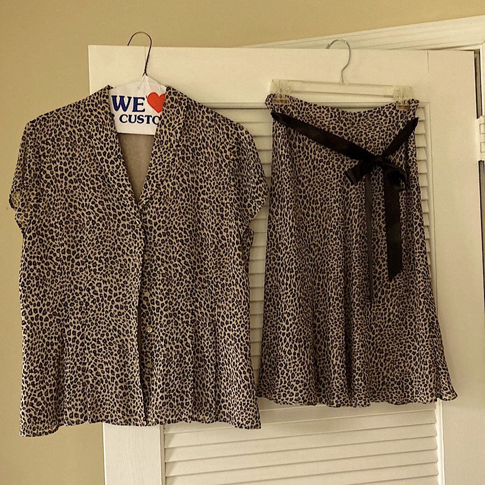 Leopard print 100% silk blouse and skirt, fully lined.